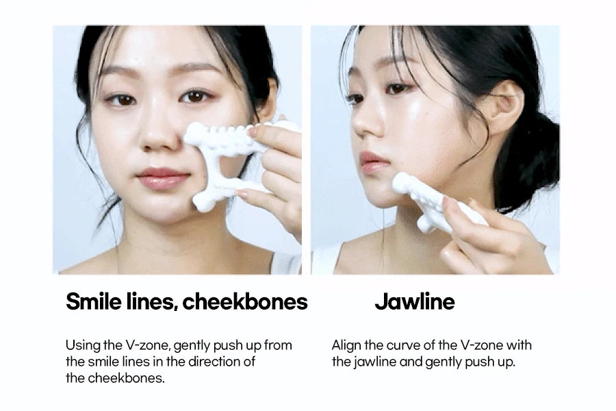 A person demonstrating how to use a white, ceramic, multi-pronged gua sha tool on their cheekbones and jawline.