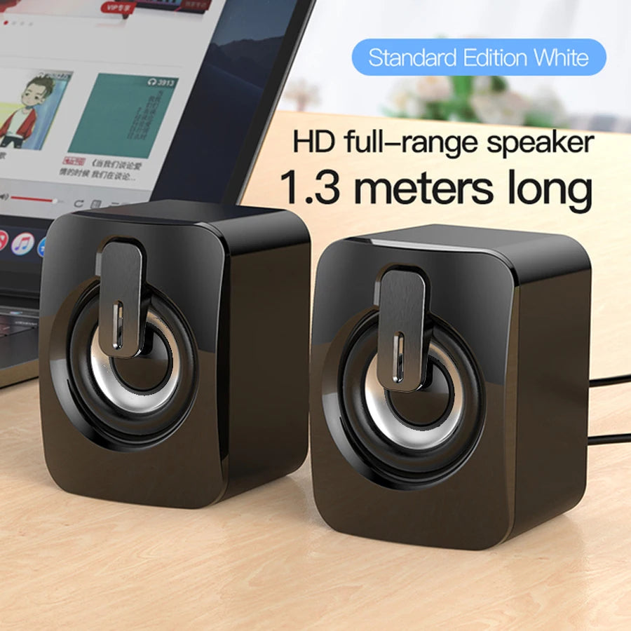Black mini desktop speaker pair with top USB port detail and front drivers