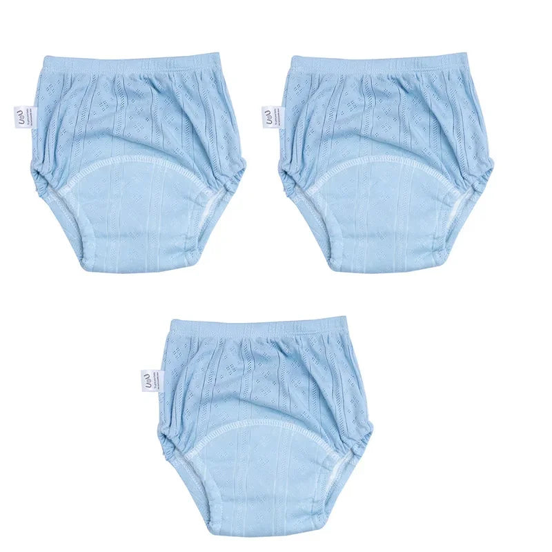Three-pack of light blue baby training diapers with textured fabric design for toddler potty training.