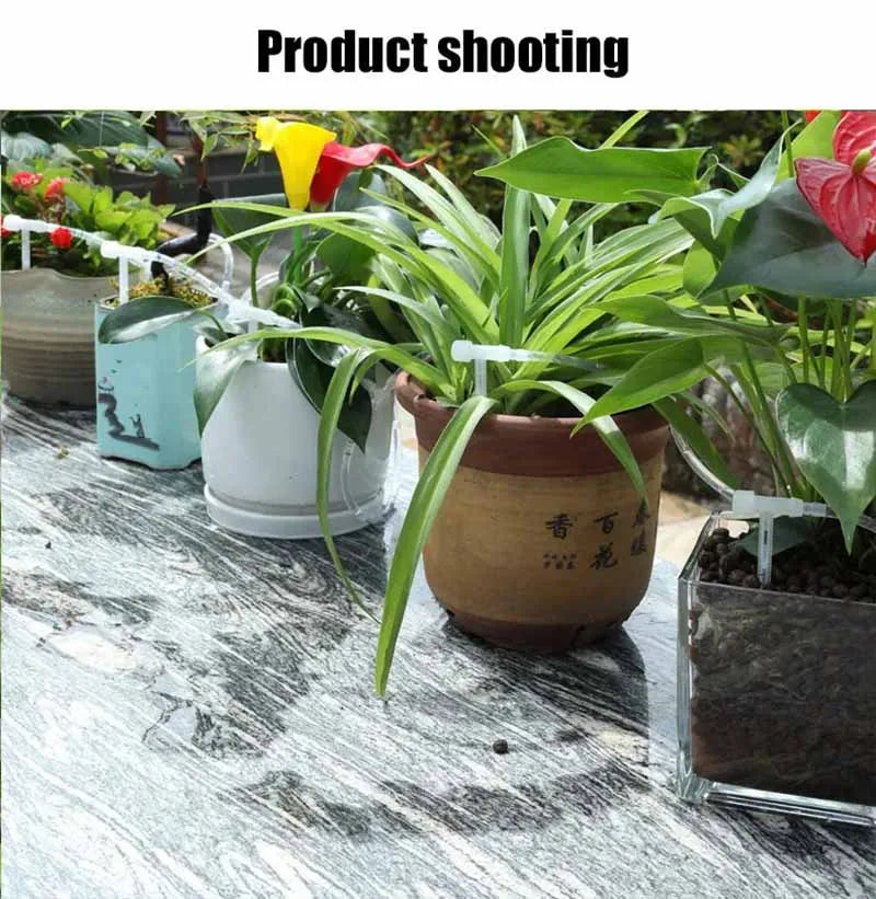 Drip irrigation tubing with adjustable valves watering potted plants outdoors