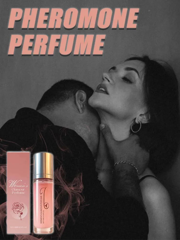 Small glass bottle of pink pheromone perfume with a gold cap next to its matching rose-illustrated packaging box.