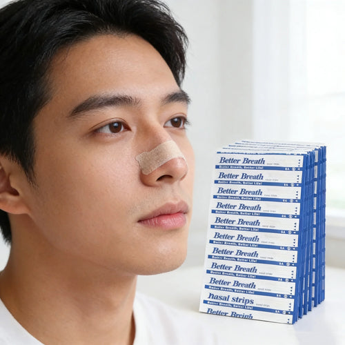 Man wearing tan Better Breath nasal strips for sleep apnea, stack of white and blue packaging on display.