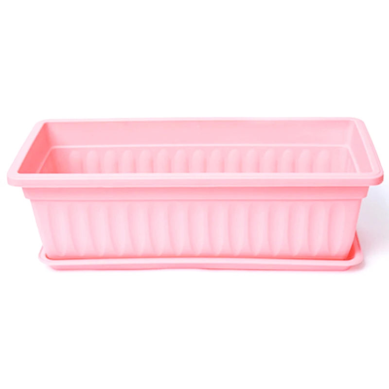 Rectangular plastic planter box with drainage slots, pink pot for balcony or indoor plants