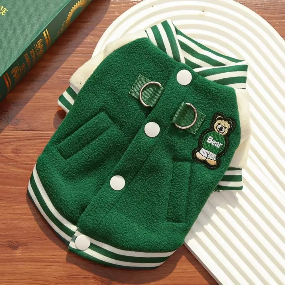 Green fleece winter baseball jacket for dogs and cats with D-ring leash attachment for warm outdoor walks.