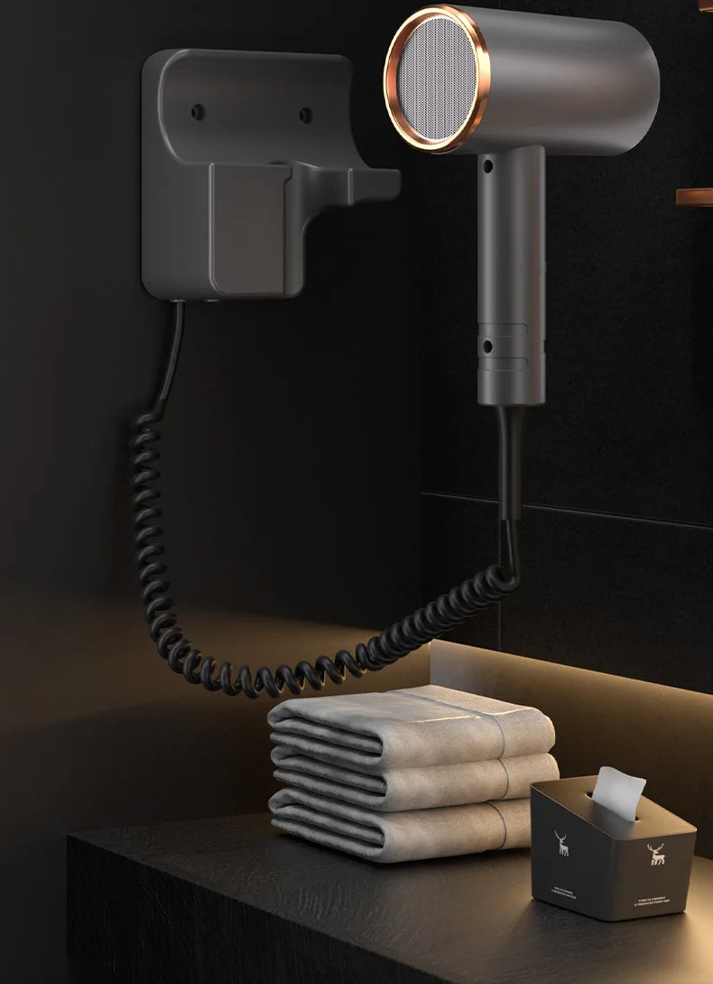 1600W grey wall-mounted hotel hair dryer with rose gold rim, coiled cord, and hole-free mount for quick drying.