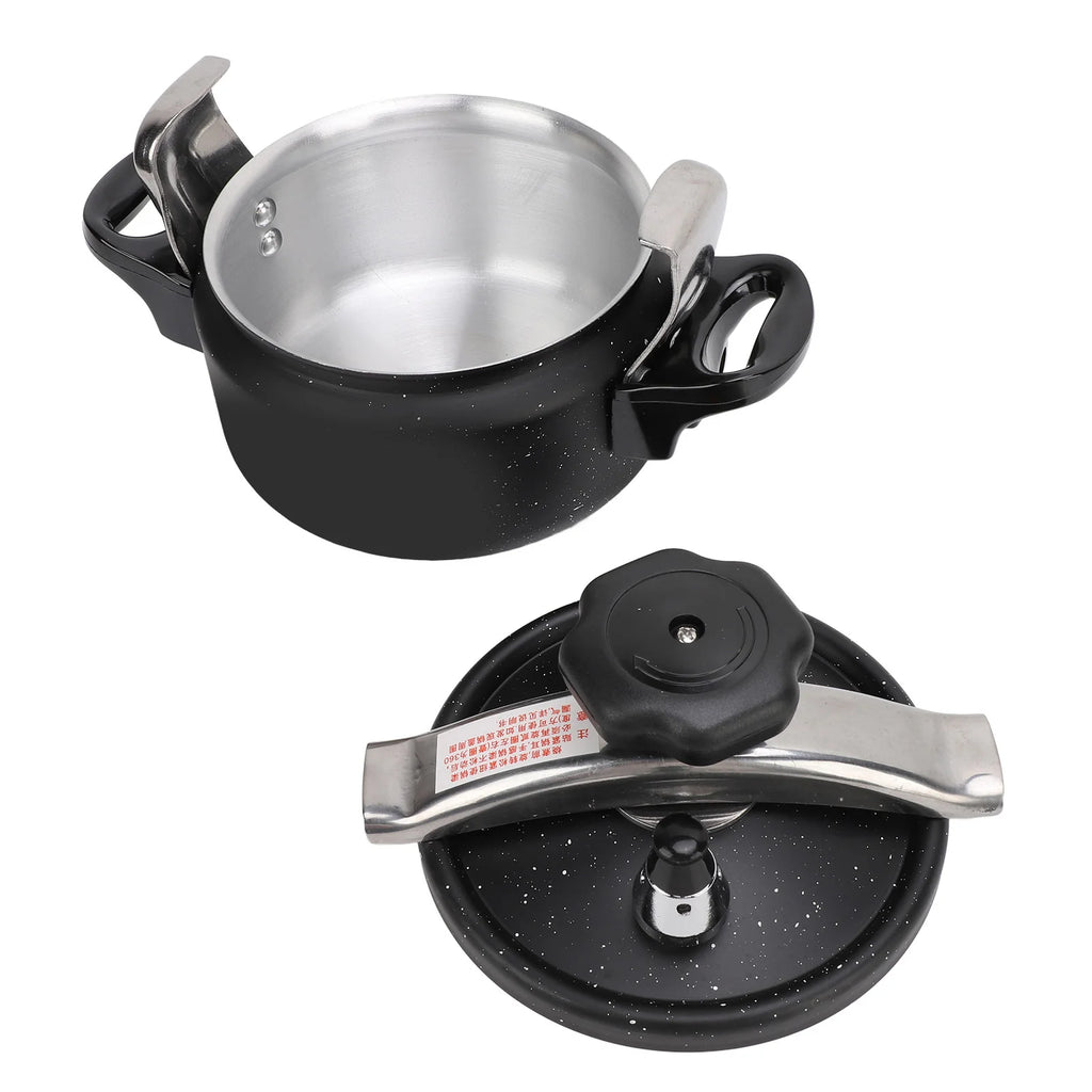 Black speckled pressure cooker with open lid showing stainless-steel inner pot and handles