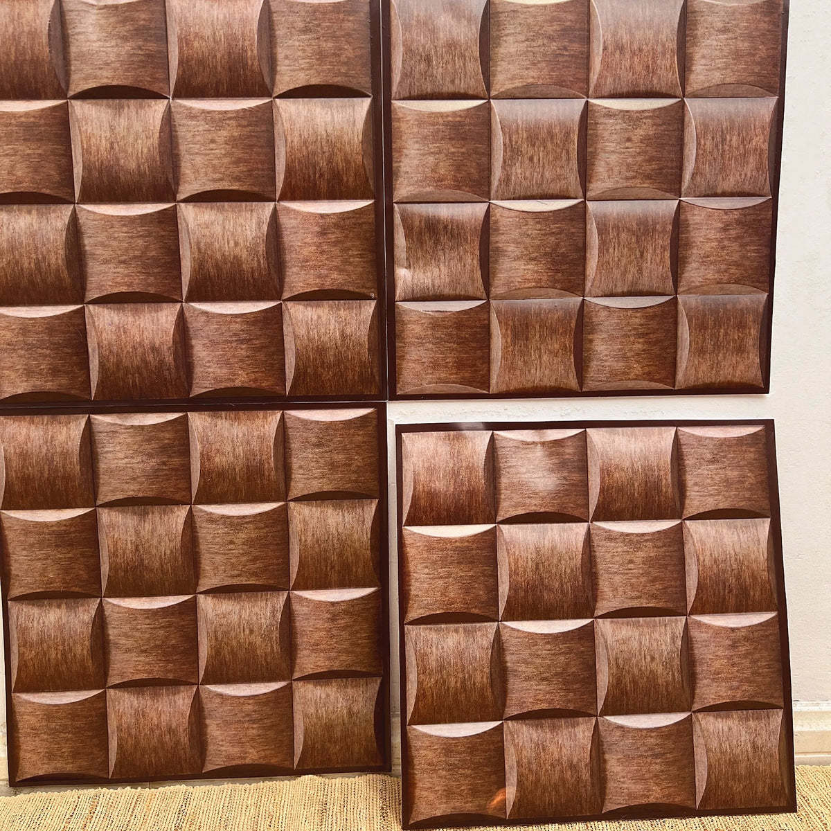 Peel-and-stick backsplash tiles with 3D cube pattern in bronze and copper tones