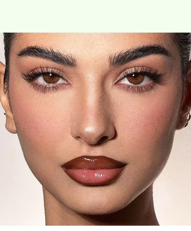 Model wearing glossy brown-toned moisturizing lip glaze with a plump, waterproof, and non-fade finish.