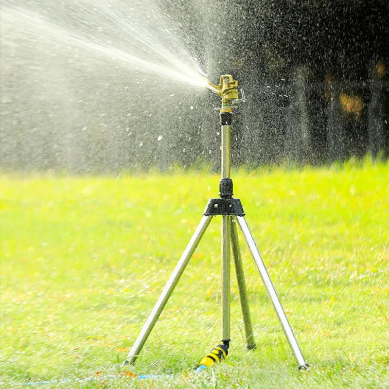 Yellow zinc alloy tripod sprinkler with rotating head, wide lawn watering spray