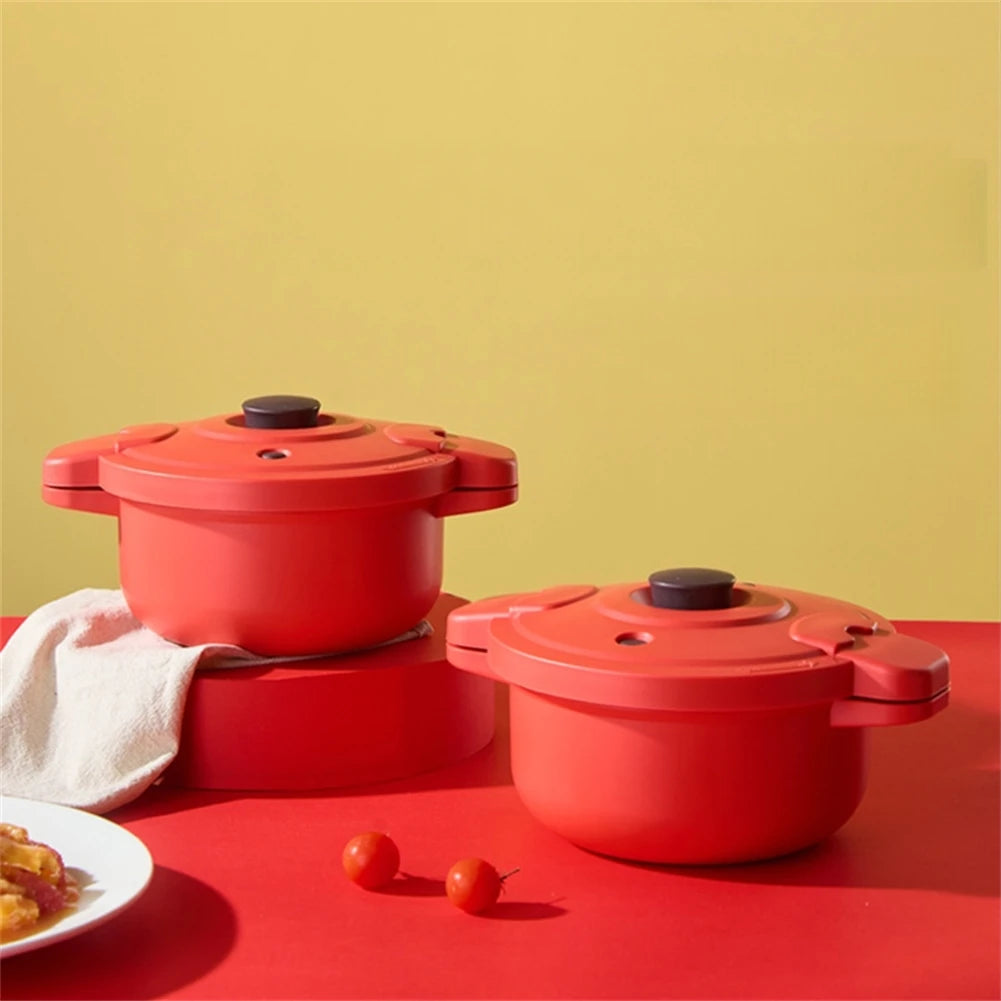 Two red microwave pressure cooker pots stacked with black vent knobs