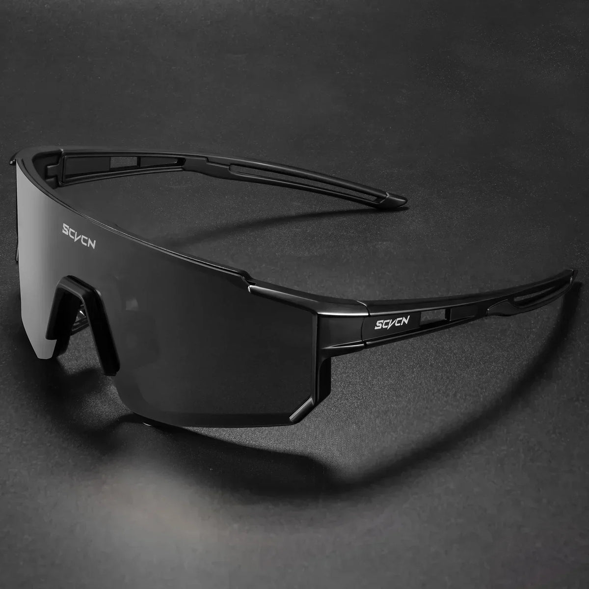 Black cycling sunglasses with dark smoke lens and wraparound sports frame
