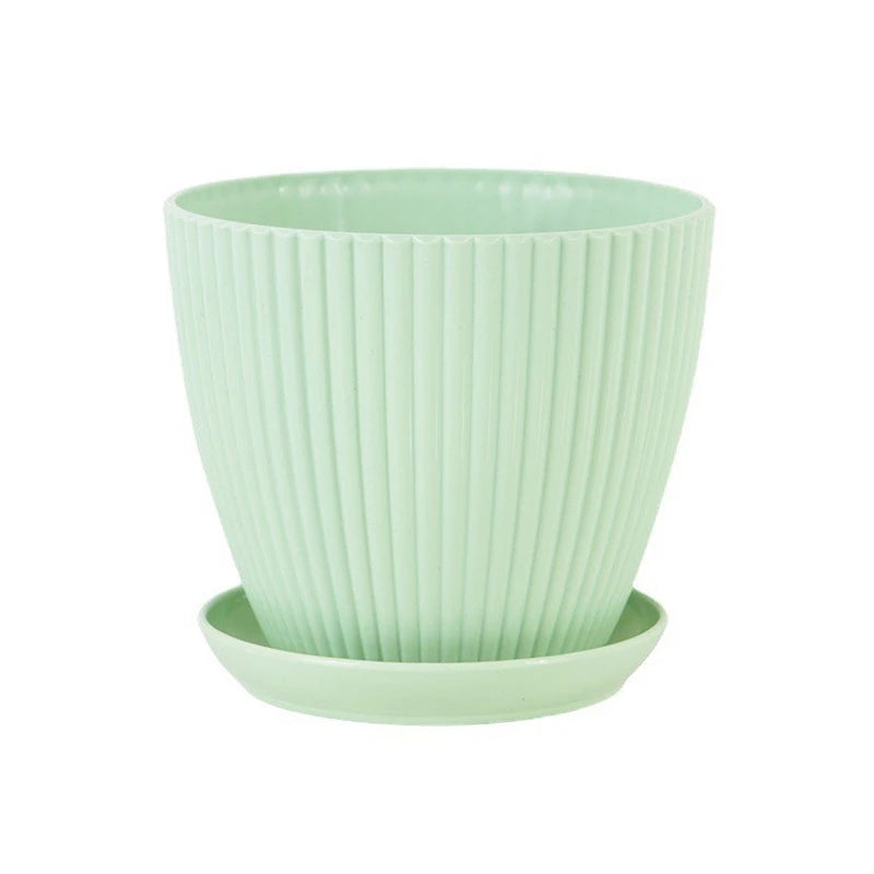 Plastic ribbed plant pot with matching tray, light green