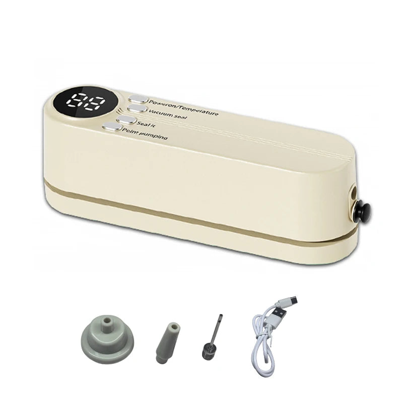 Compact vacuum sealer machine in cream with included attachments and power cable