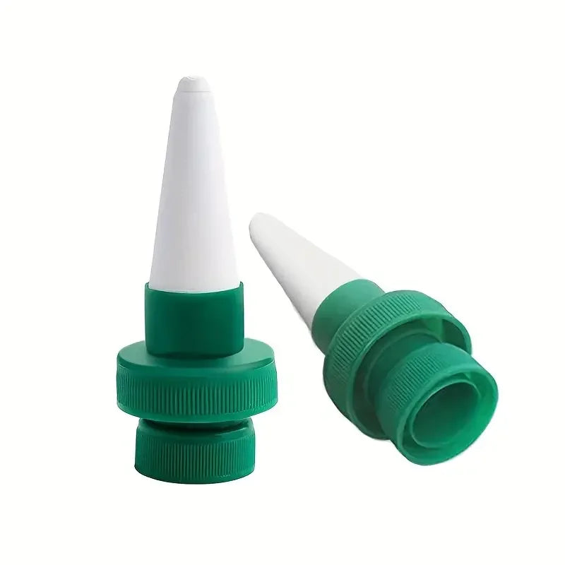 Two plant drip irrigation stakes with white spikes and green ribbed connectors.