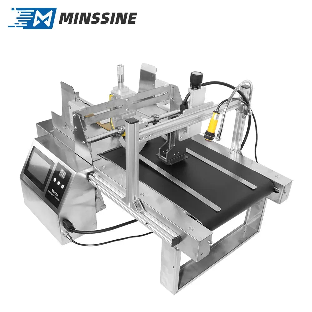 Industrial label paging printer with print carriage and metal conveyor bed