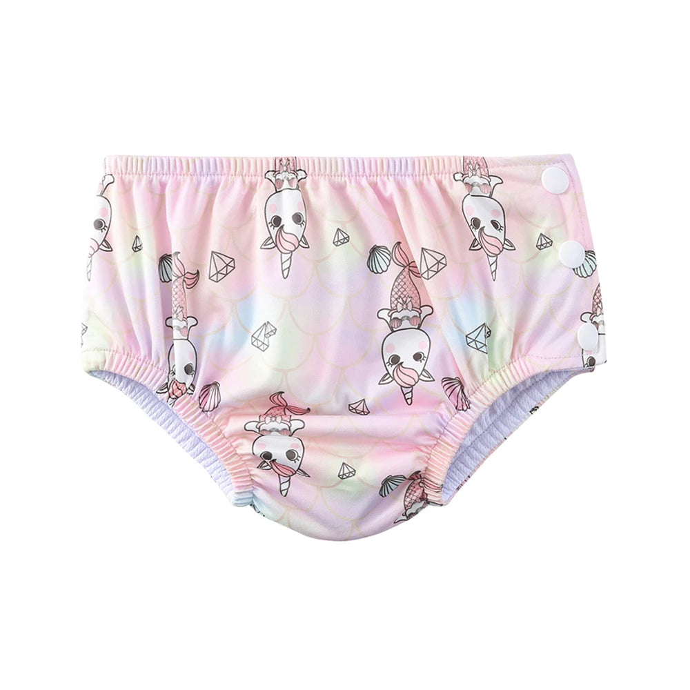 Reusable baby swim diaper featuring pink unicorn mermaid print with side snap closures.