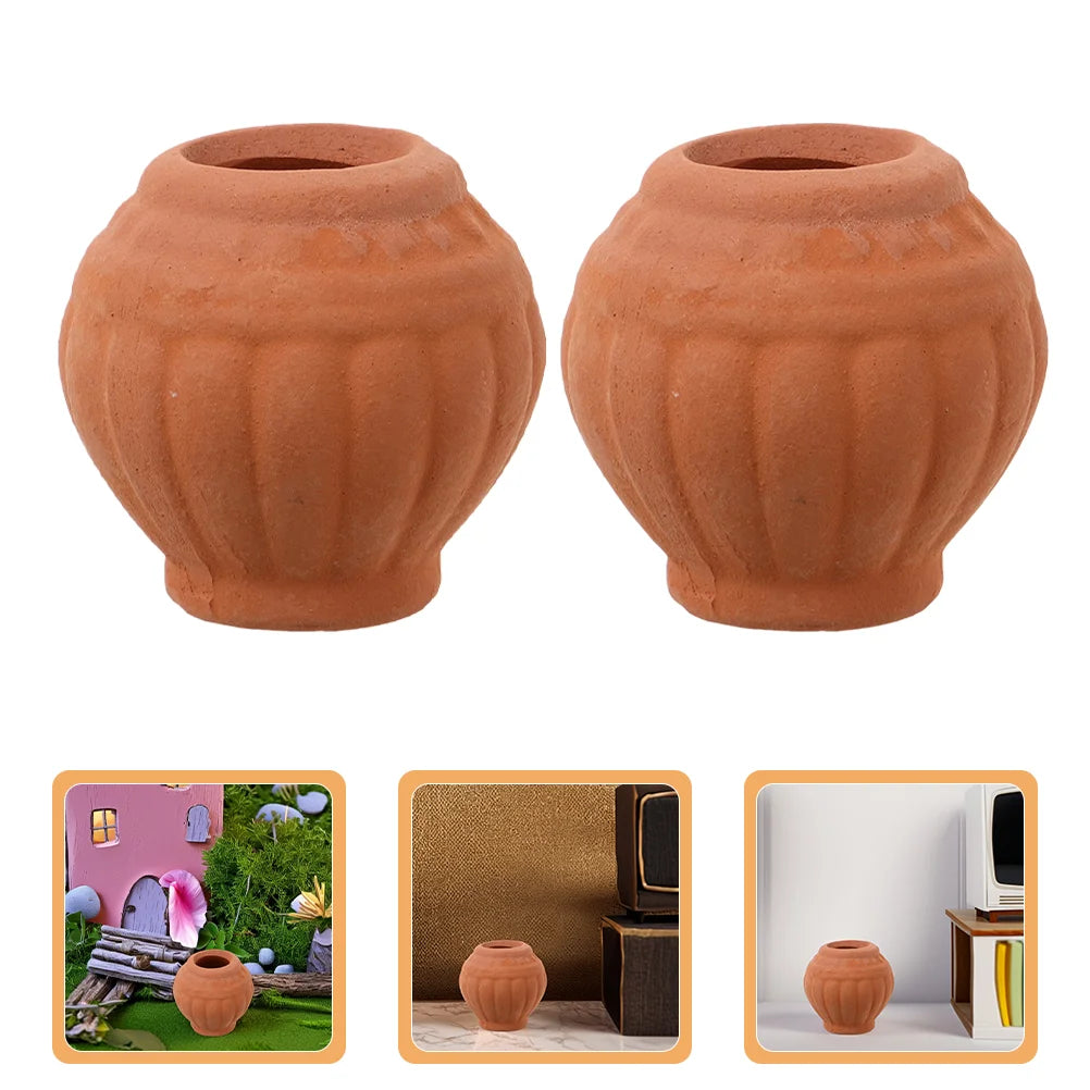 Two small terracotta succulent planter pots with ribbed texture and drainage holes