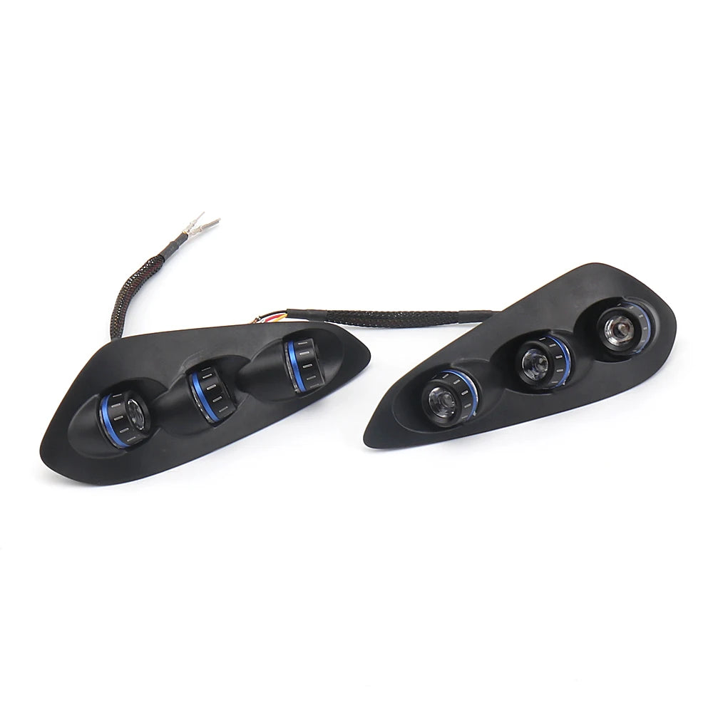 Black LED tail and turn signal light modules with blue accent rings, wiring visible