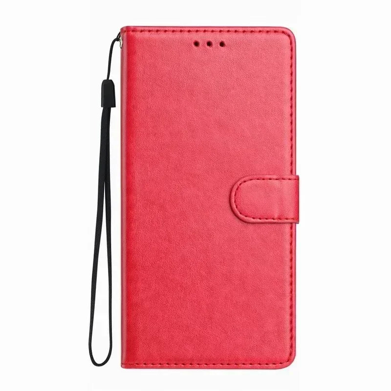 Red faux leather wallet phone case with a magnetic strap closure and a black wrist lanyard.