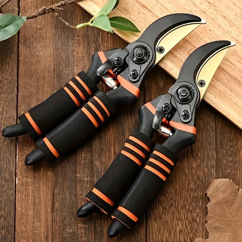 Pruning shears with black handles, orange grip bands, and curved gold cutting blades
