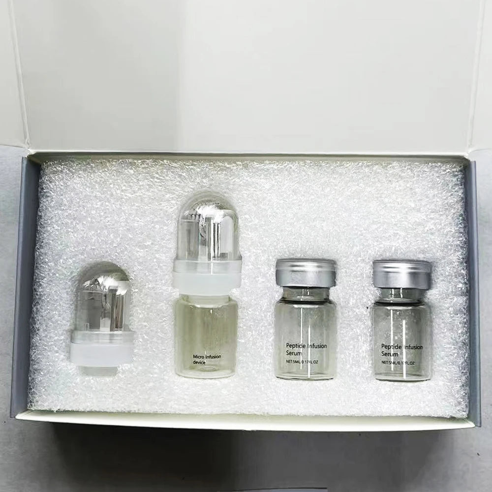 Skincare set in a box with a clear micro infusion device and two glass vials of Peptide Infusion Serum.