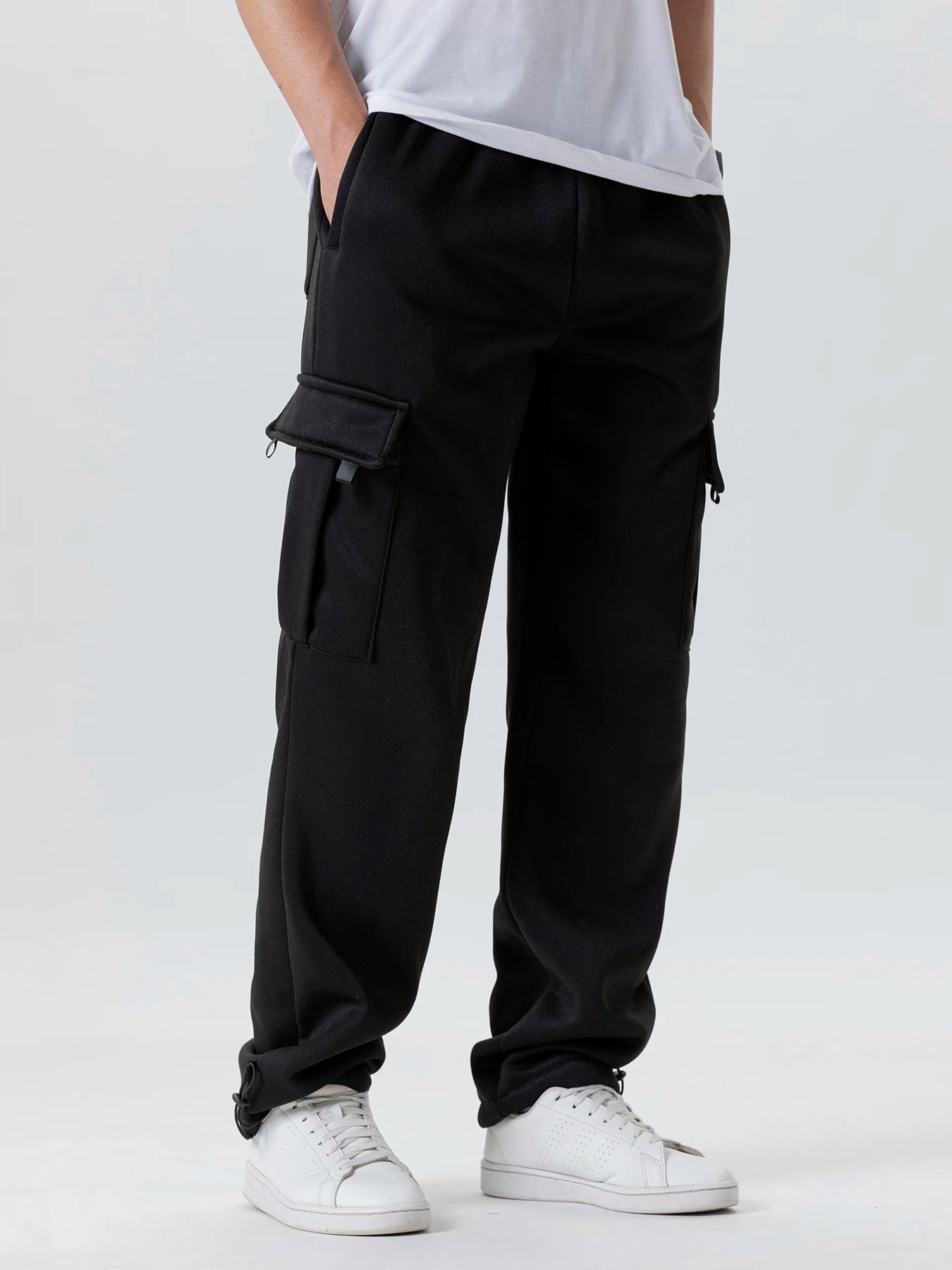 Tidesmit men's loose-fit black sweatpants with large side cargo pockets and straight leg cut on a neutral background.