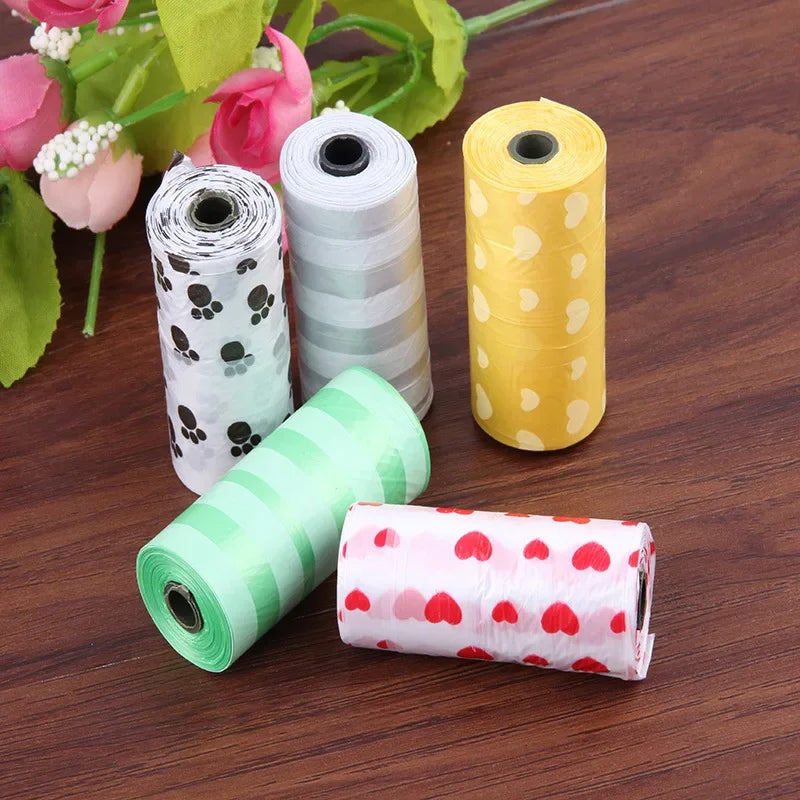 Colorful leak-proof dog poop bags with cute cartoon paw and heart prints for easy pet waste cleanup.