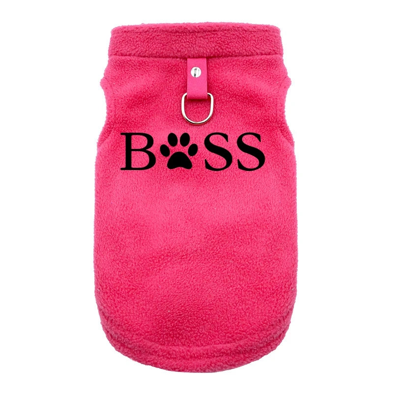 Pink fleece winter vest for small dogs with 'BOSS' print and leash ring, keeps pets warm and stylish.