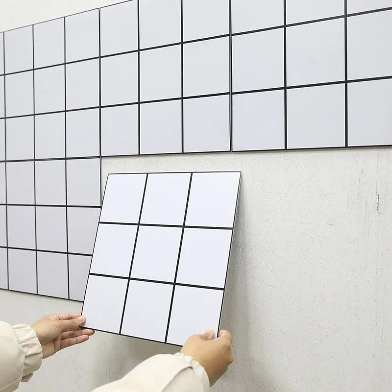 Peel-and-stick backsplash tiles with white square grid pattern, self-adhesive sheet