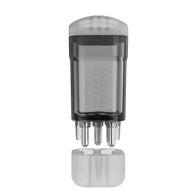 Clear plastic skincare tool with ml markings, metallic applicator tips, and a removable frosted cap.