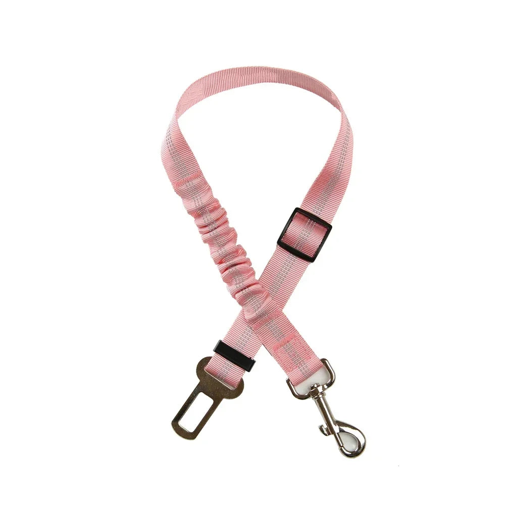 Adjustable pink reflective dog car seat belt with elastic buffer for safe travel for small to large dogs.