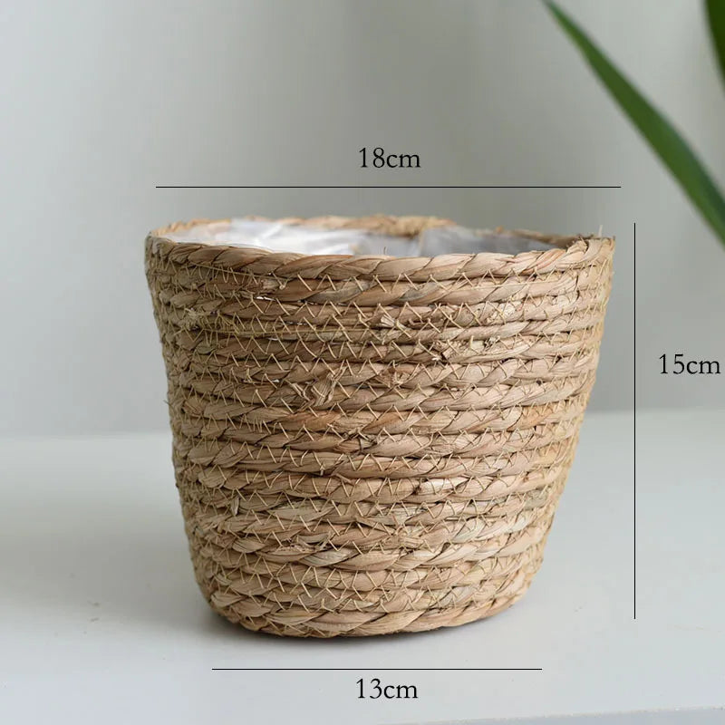 Tan straw woven plant pot basket planter with open top and tight weave