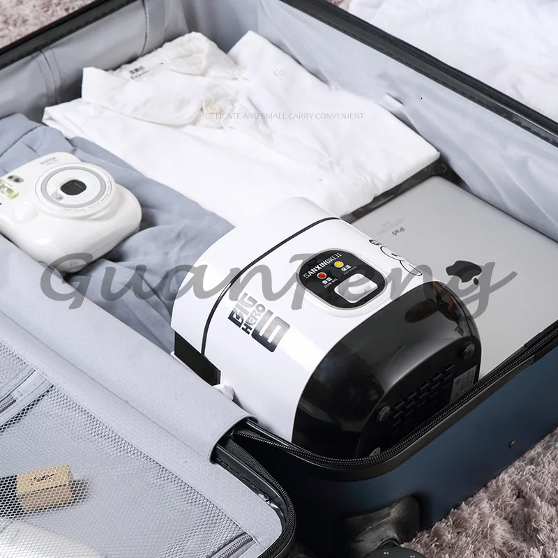Mini rice cooker stored in a travel case with accessories and power cord