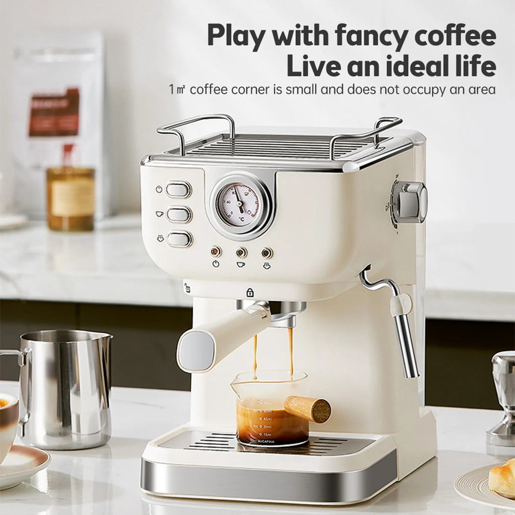 Compact retro cream espresso machine with pressure gauge, steam wand, and portafilter, pouring coffee into a glass.