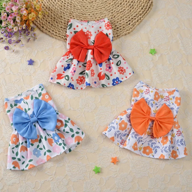 Cute floral princess dresses for small dogs and kittens with large bows, perfect for stylish summer pet outfits.
