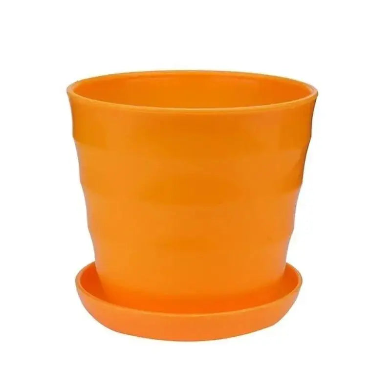 Orange plastic flower pot with matching saucer base, desktop succulent planter