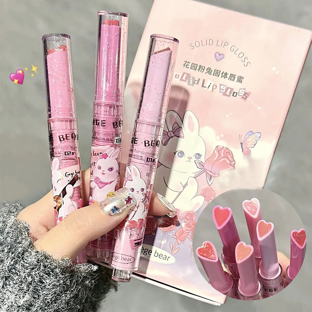 Gege Bear moisturizing solid lip gloss in pink rabbit packaging with heart-shaped, watery colored lipstick bullet.
