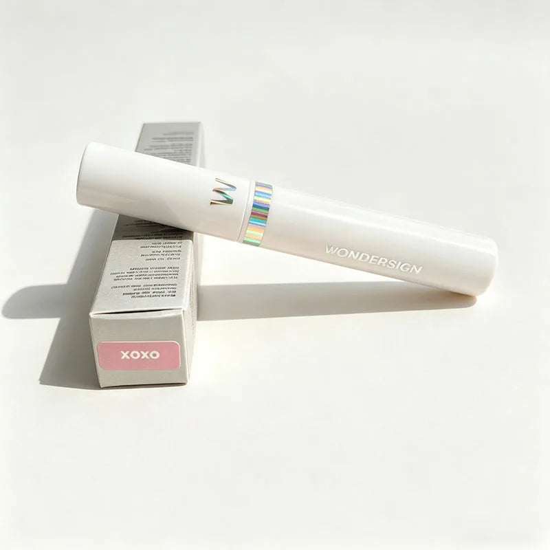 Wonderskin long-lasting waterproof peel-off lip stain in XOXO pink, white tube and packaging on white background.