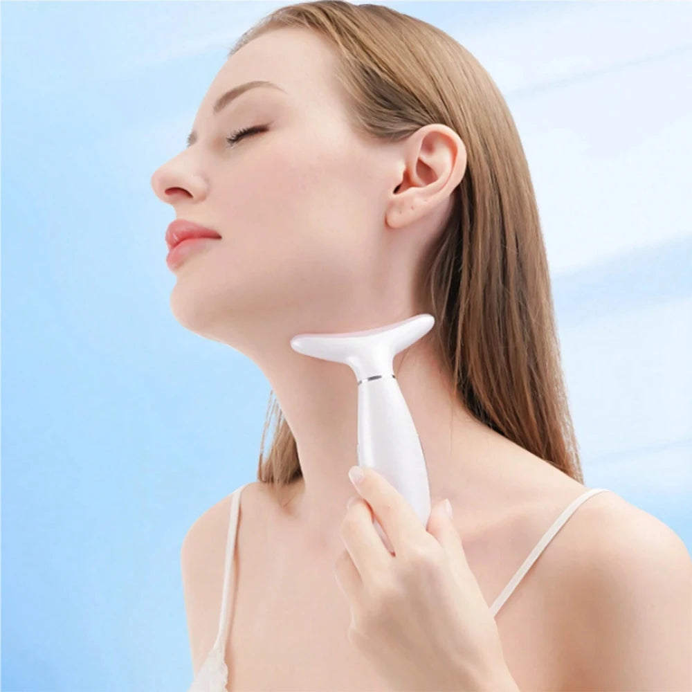 A woman uses a white, T-shaped handheld facial massager on her neck against a light blue background.