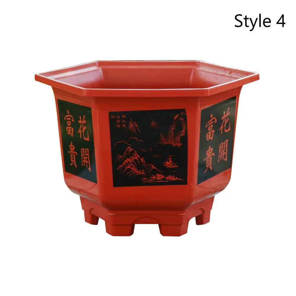 Red resin planter pot with black scene panel and decorative side text