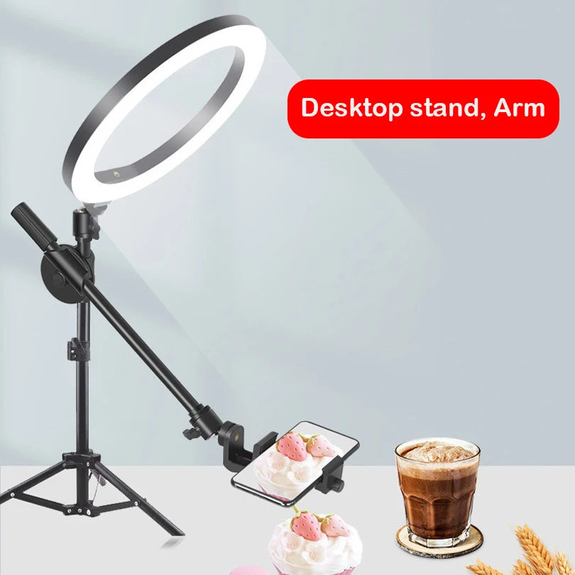 Black metal desktop ring light stand with adjustable arm and phone holder for overhead photography and video recording.