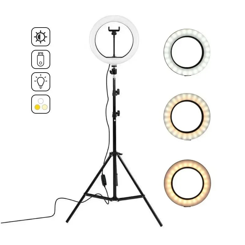 Black metal ring light on an adjustable tripod stand with a phone holder, showing three color temperature modes.