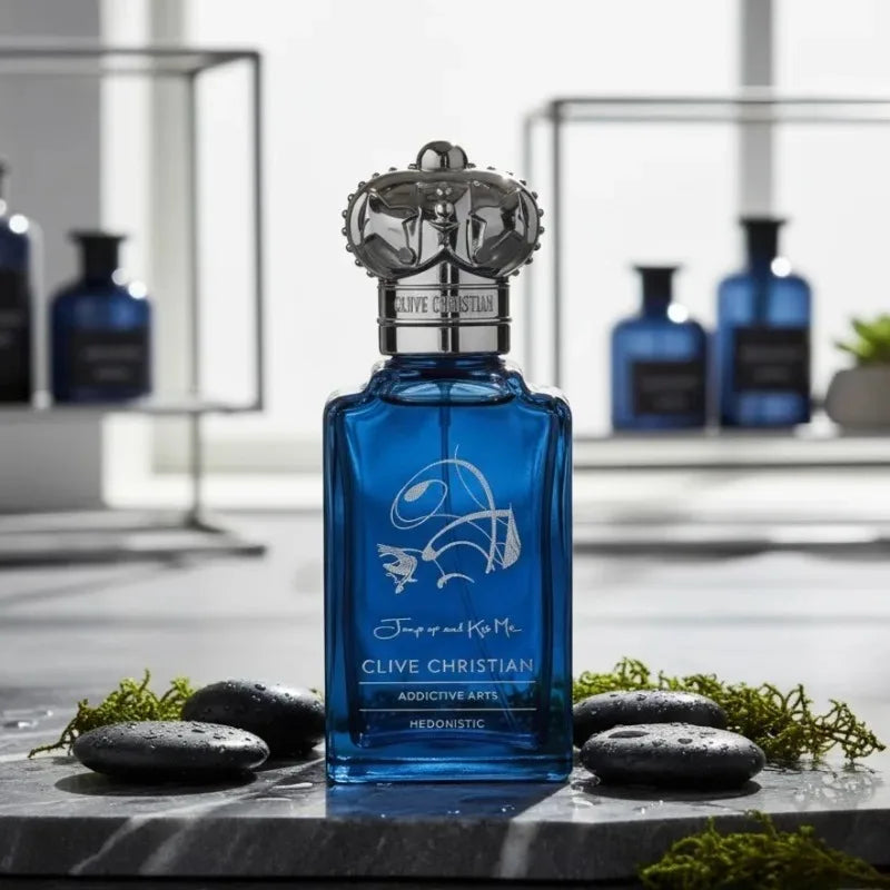 Clive Christian Jump Up and Kiss Me EDP: Unisex oriental floral woody amber scent in a blue bottle with crown cap.