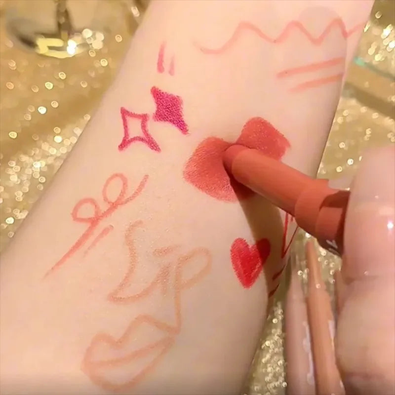 Dual-ended rose red and nude matte lip liner pencil swatched on arm for waterproof, long-lasting lip makeup.