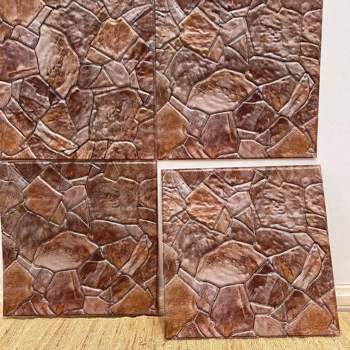 Stone-look peel-and-stick backsplash tiles in brown, tan, and reddish hues (12 in x 12 in).