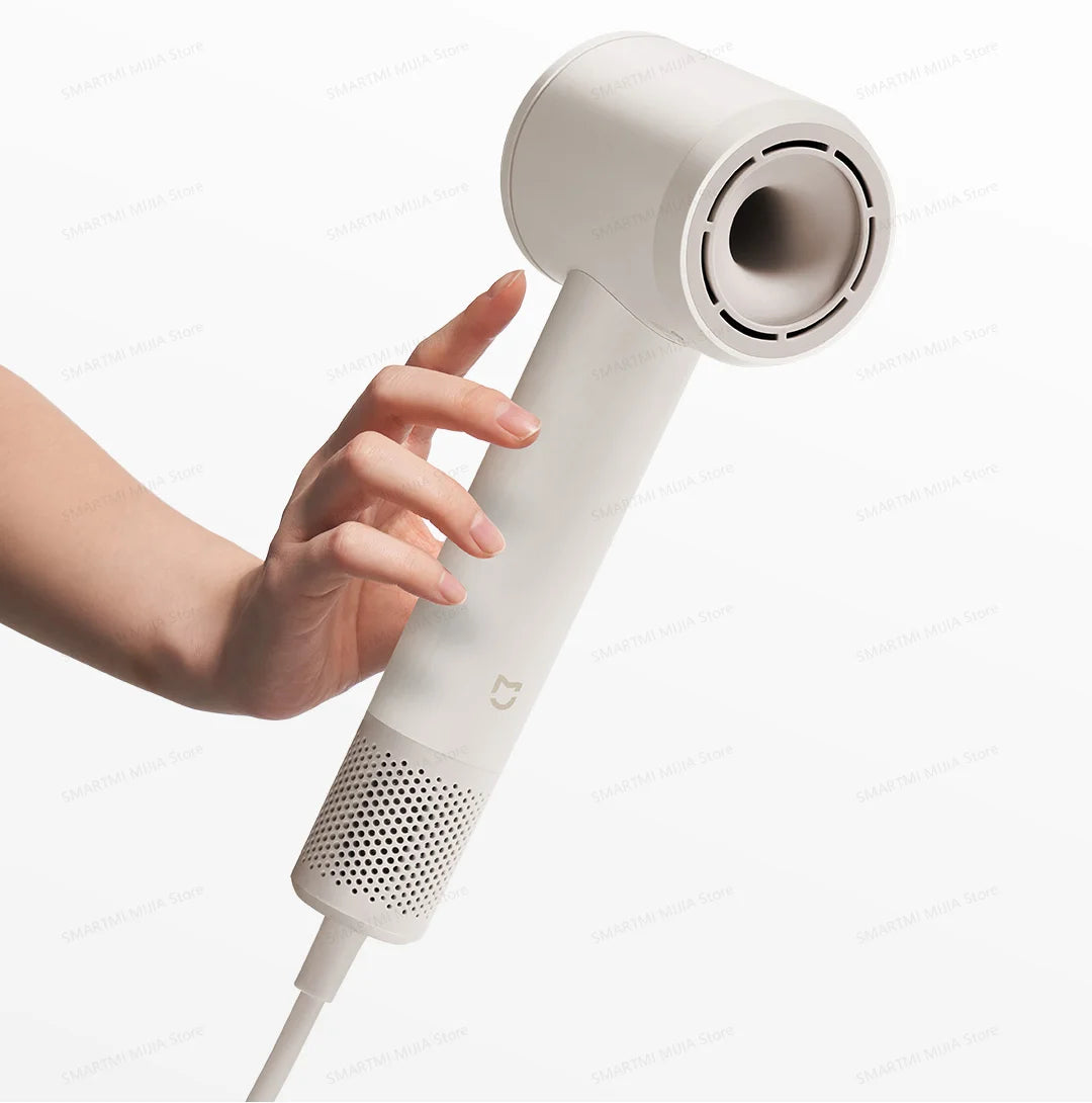 Handheld beige MIJIA high-speed hair dryer with sleek, lightweight design and powerful 110,000rpm motor airflow.