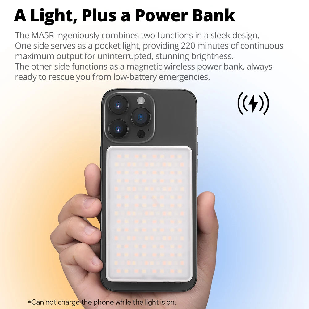 MA5R rectangular LED light and magnetic wireless power bank attached to the back of a black smartphone.
