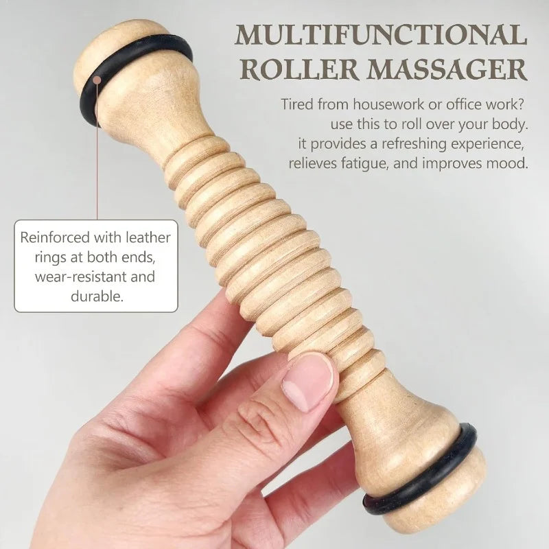 Handheld wooden foot massage roller with ribbed texture and black end rings for stress relief and muscle relaxation.