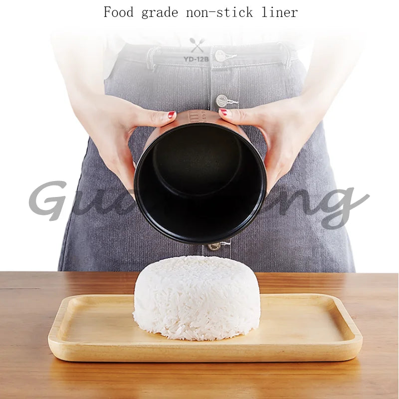 Portable mini rice cooker inner pot being filled, steaming rice on a wooden tray