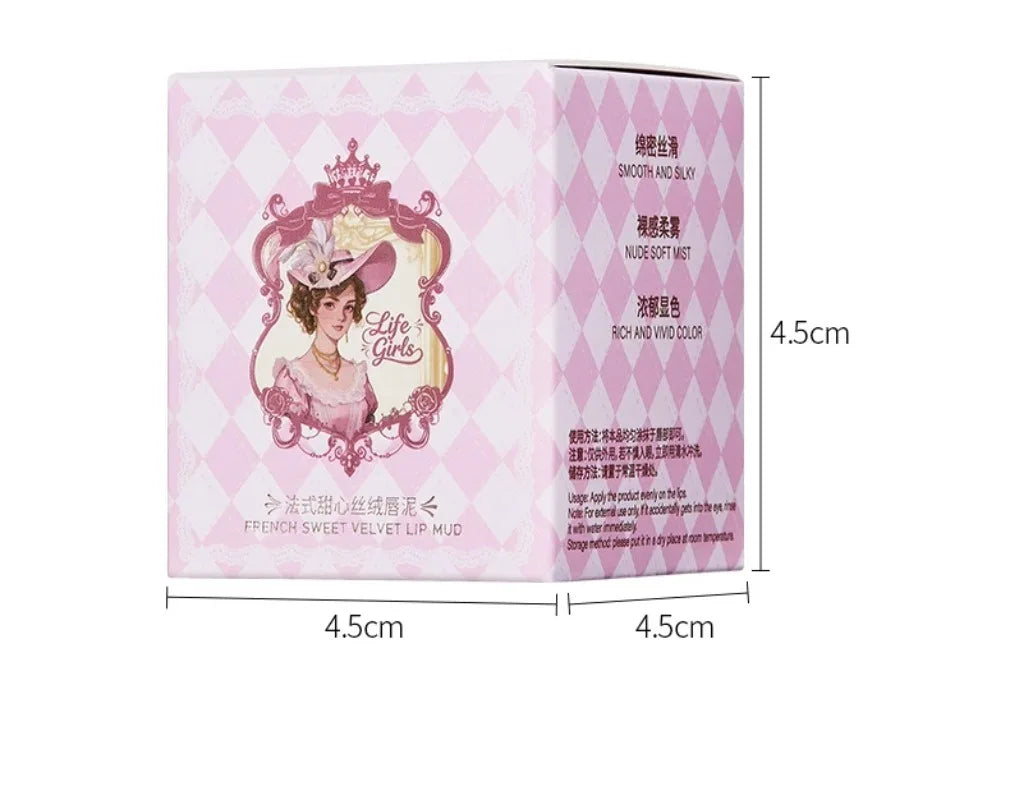 Vintage matte velvet lip mud in pink diamond-patterned packaging with elegant lady illustration. Soft focus lip makeup.